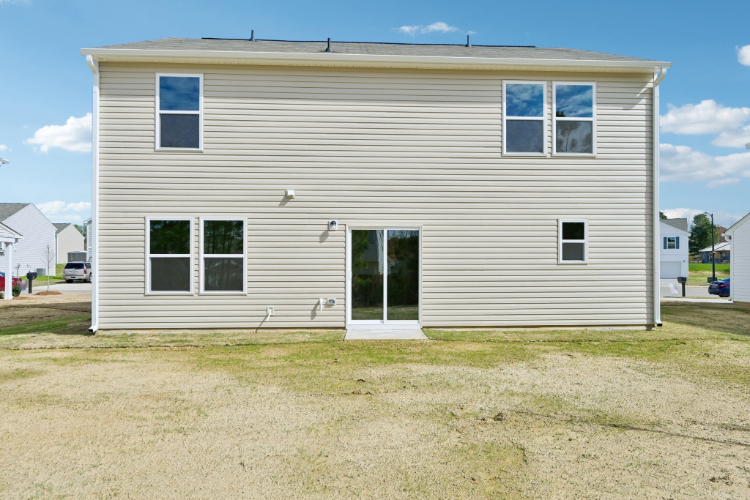 A white house with a garage.