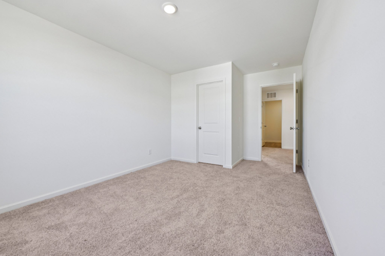 A hallway with white doors.
