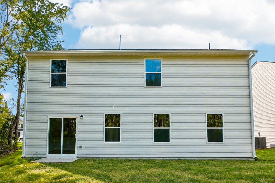 A grey house with windows.