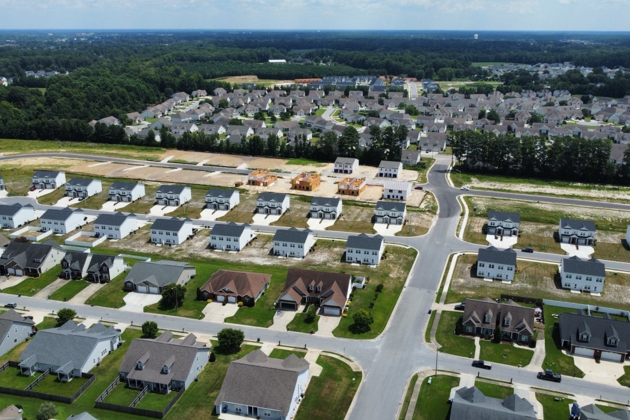 A group of houses in a field.