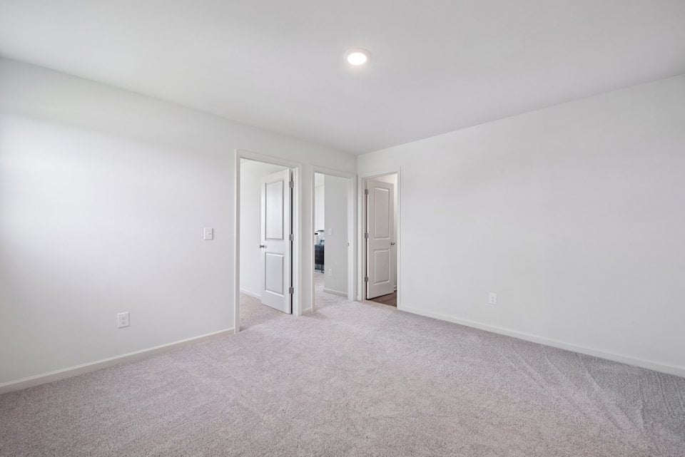 A hallway with white walls.
