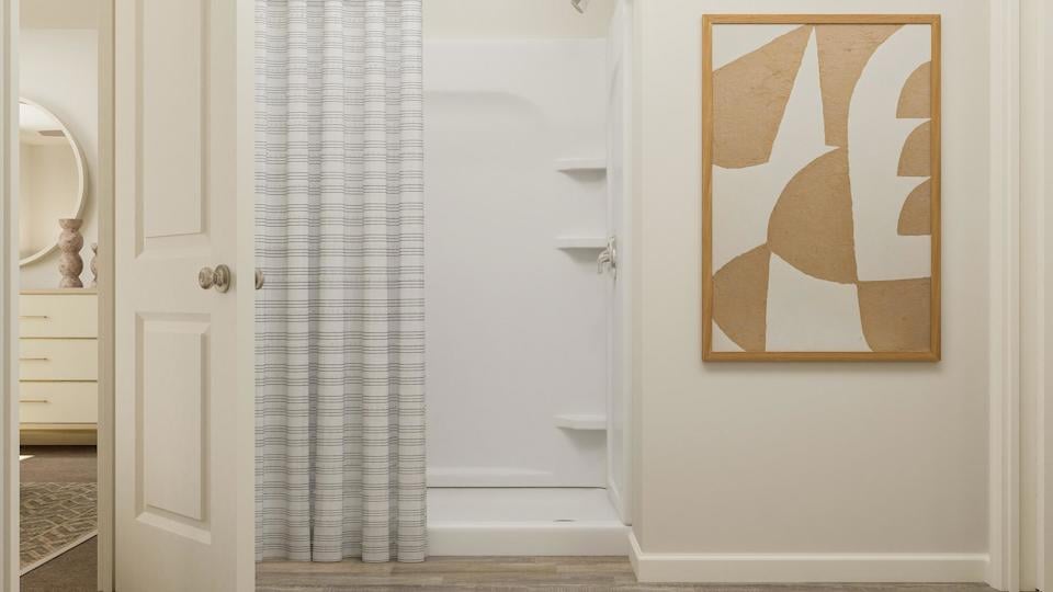 A bathroom with a shower curtain.