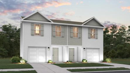 A house with garages and trees.