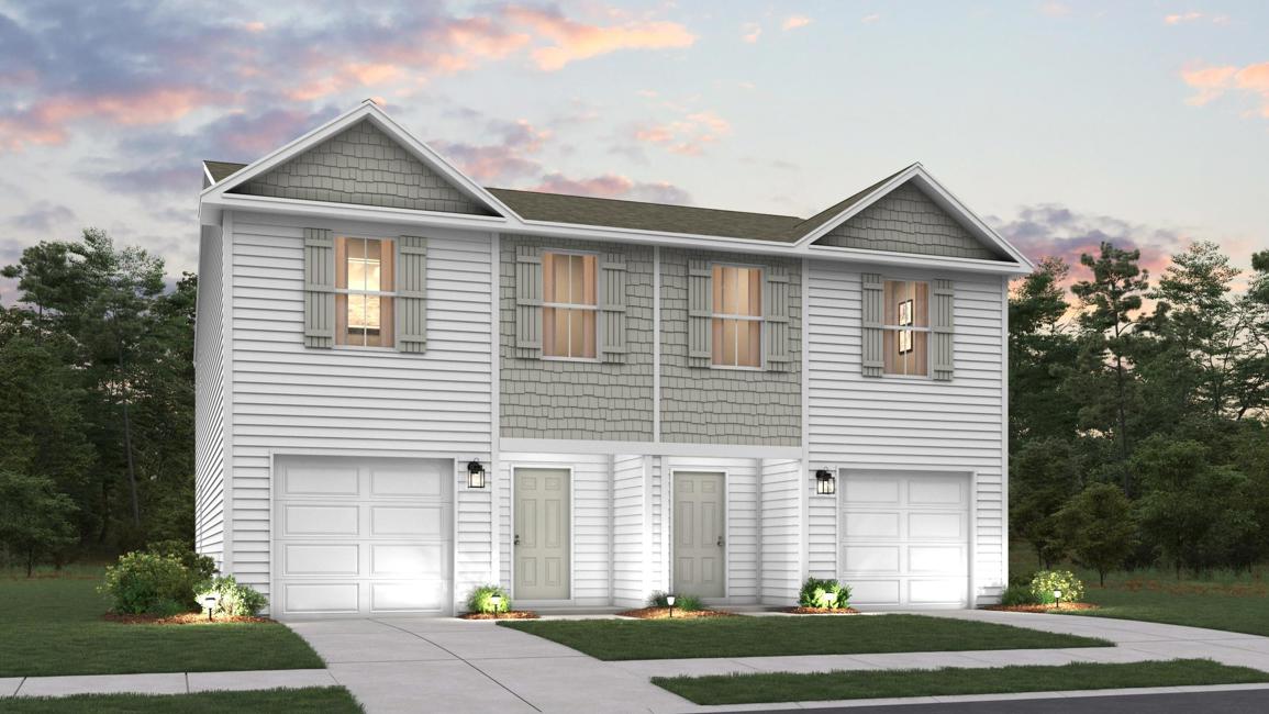 A house with garages and trees.