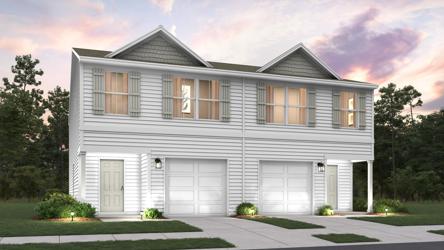 A house with garages and trees.