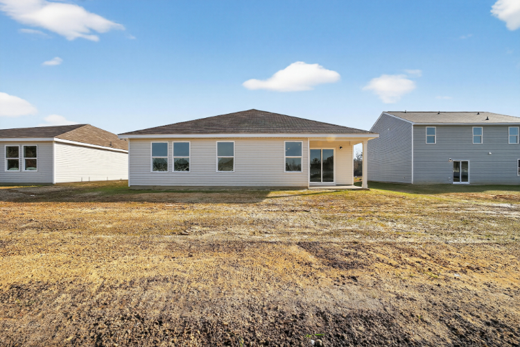 A few houses in a field.