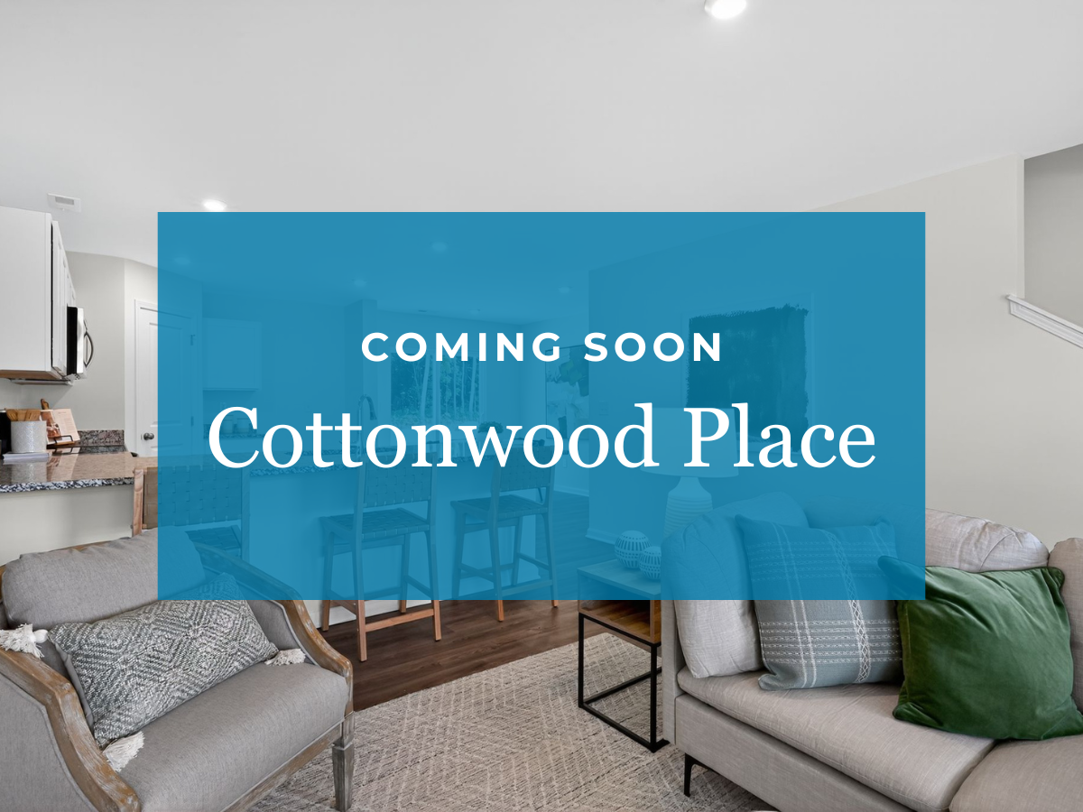 A room with a couch and a table.