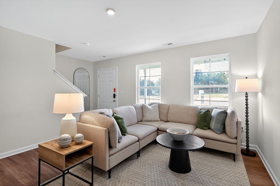 A living room with a couch and a coffee table.