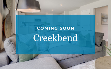 A couch with a blue wall.