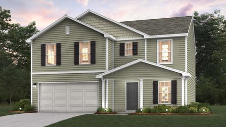 A white house with a garage.