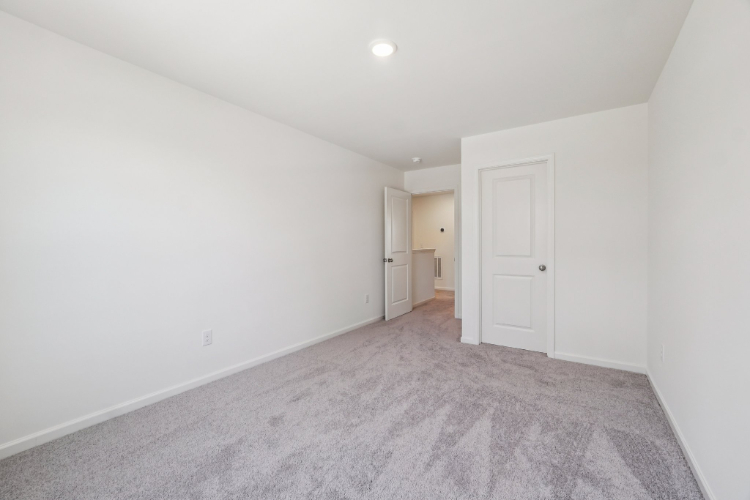 A hallway with white doors.