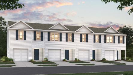 A white house with black shutters.