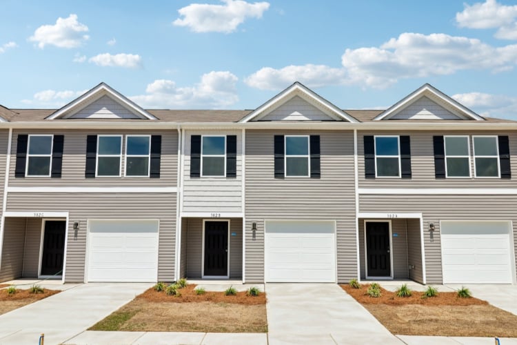 A house with garages and a driveway.