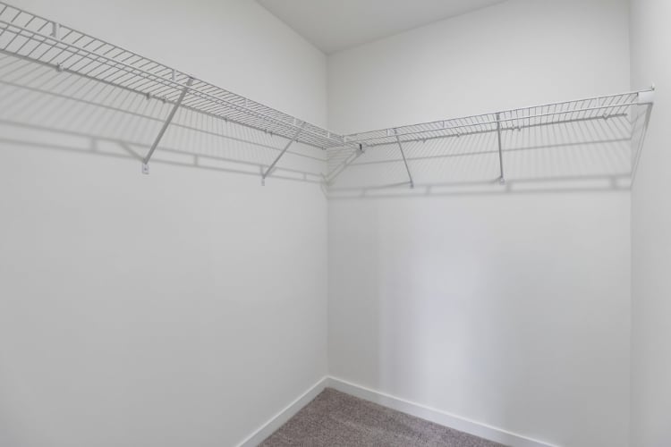 A white room with a metal railing.