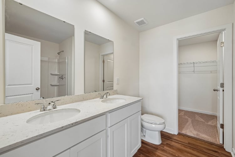 A bathroom with a sink toilet and shower.
