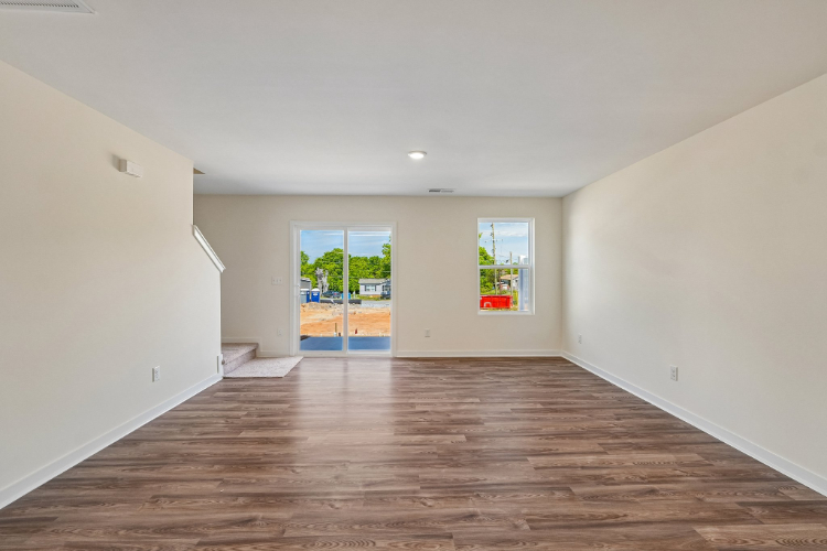 A room with a wood floor and a wood floor.