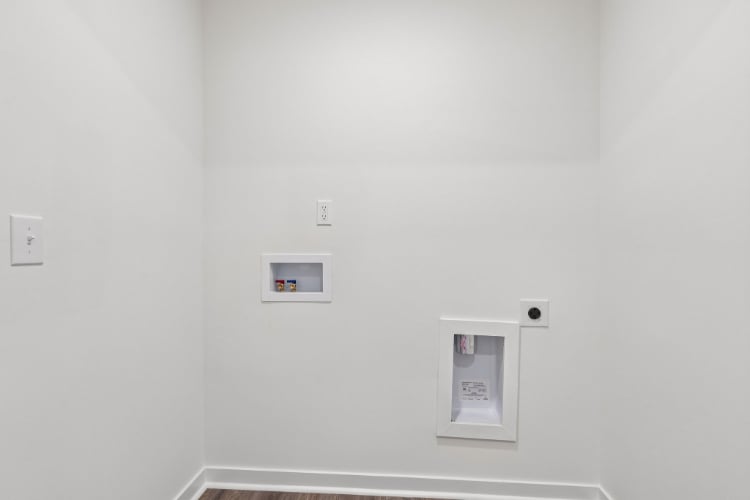 A white wall with switches.