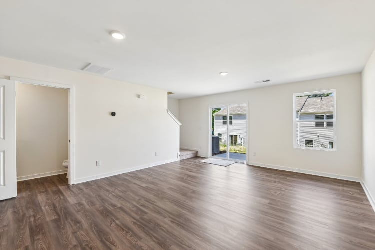 A room with a wood floor and a wood floor.