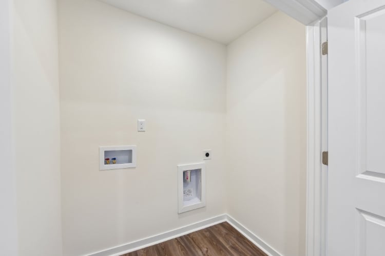A hallway with white walls.