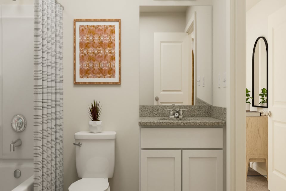 A bathroom with a marble countertop.
