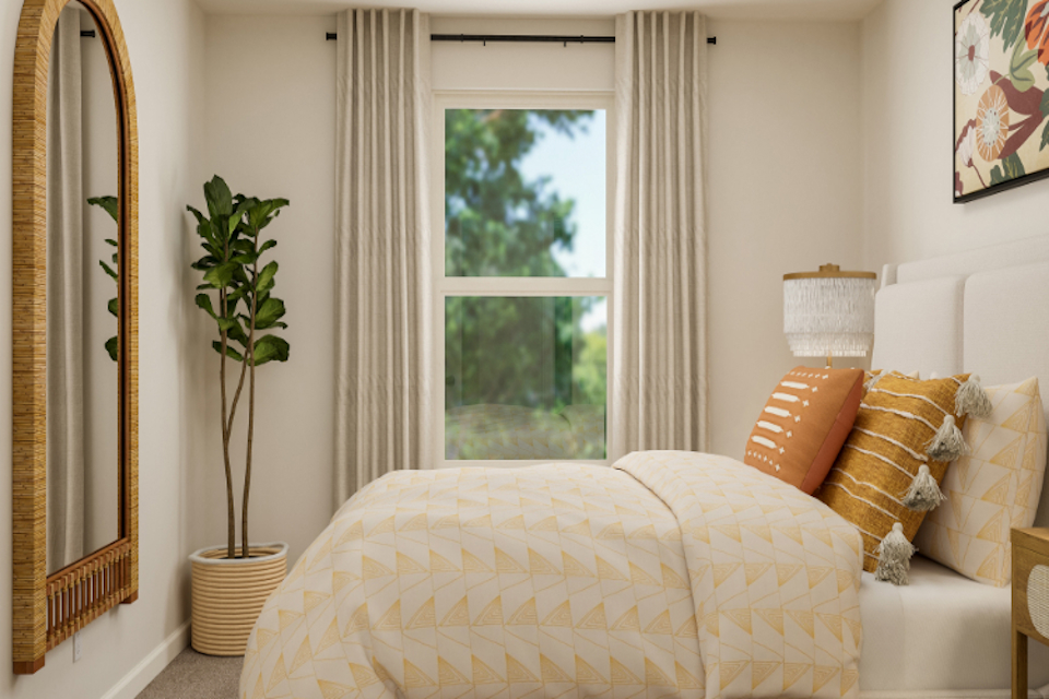 A bedroom with a large window.