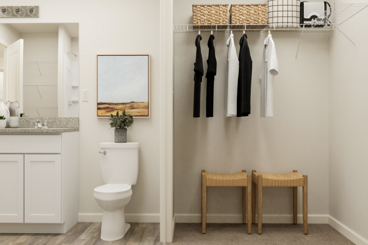 A bathroom with a toilet and stool.