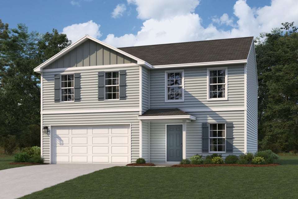 A white house with a garage.