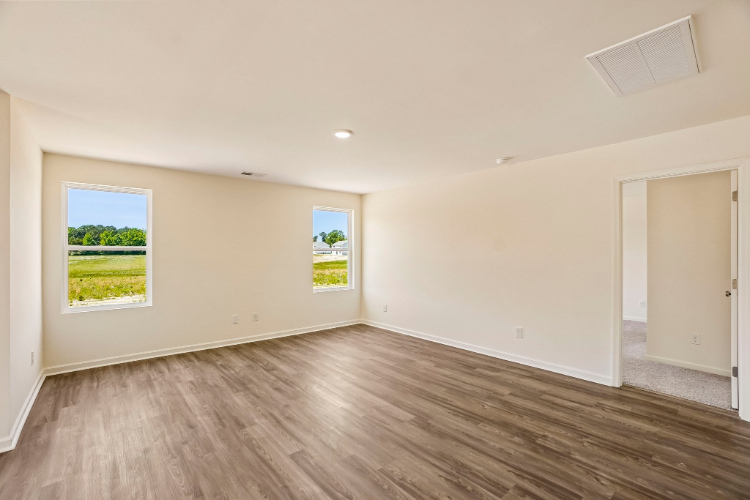 A room with a wood floor and a wood floor.