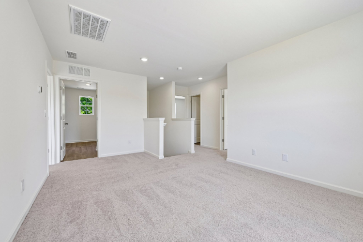 A long hallway with white walls.