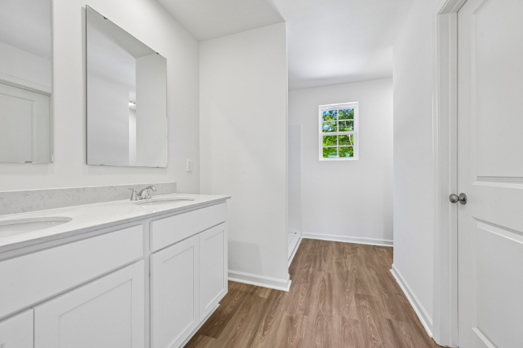 A white kitchen with white cabinets.