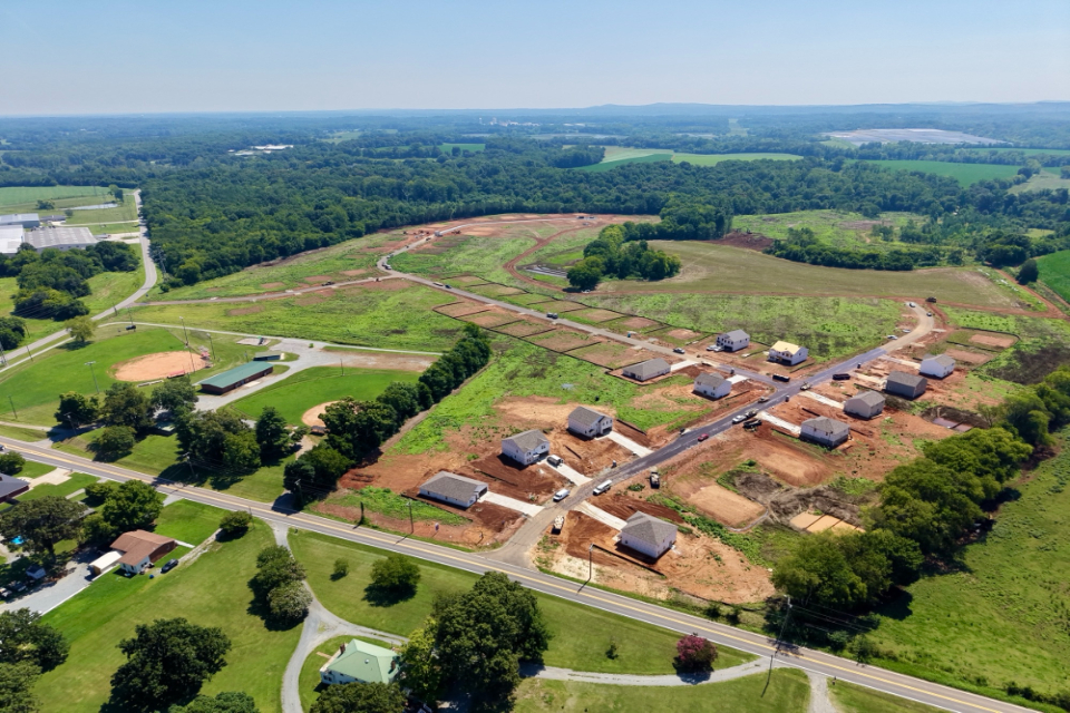 A large area with many buildings and trees.