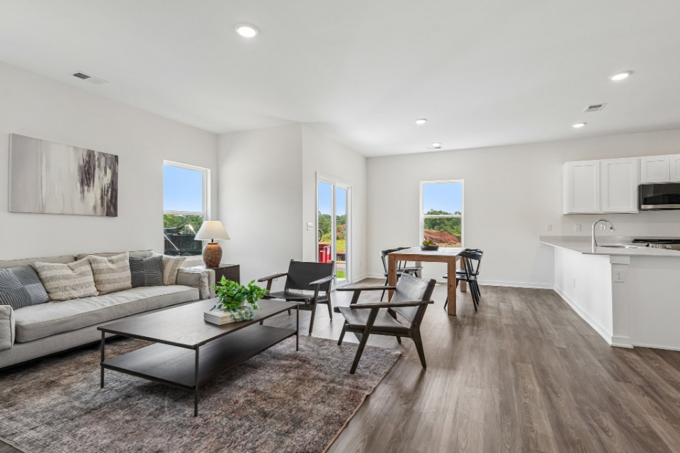 A living room with a wood floor.