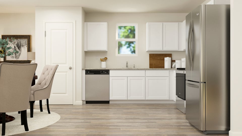 A kitchen with white cabinets.