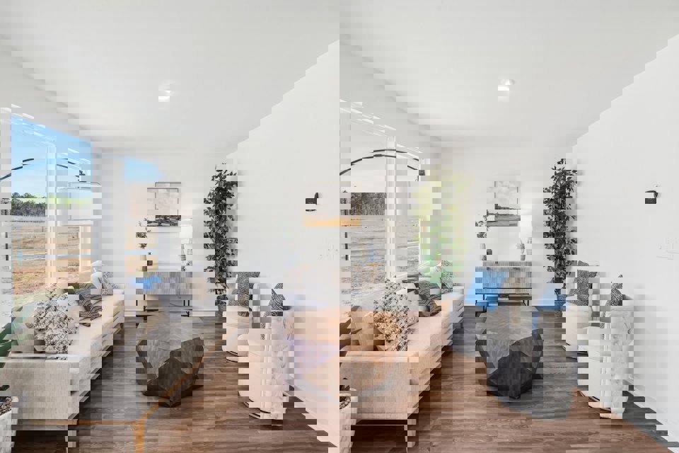 A living room with a large glass door.