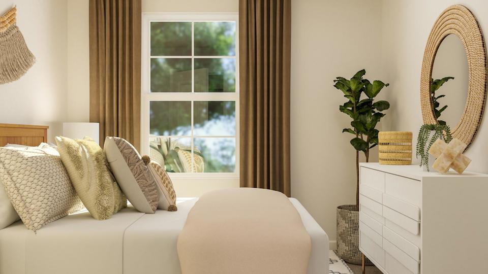 A white couch with pillows.