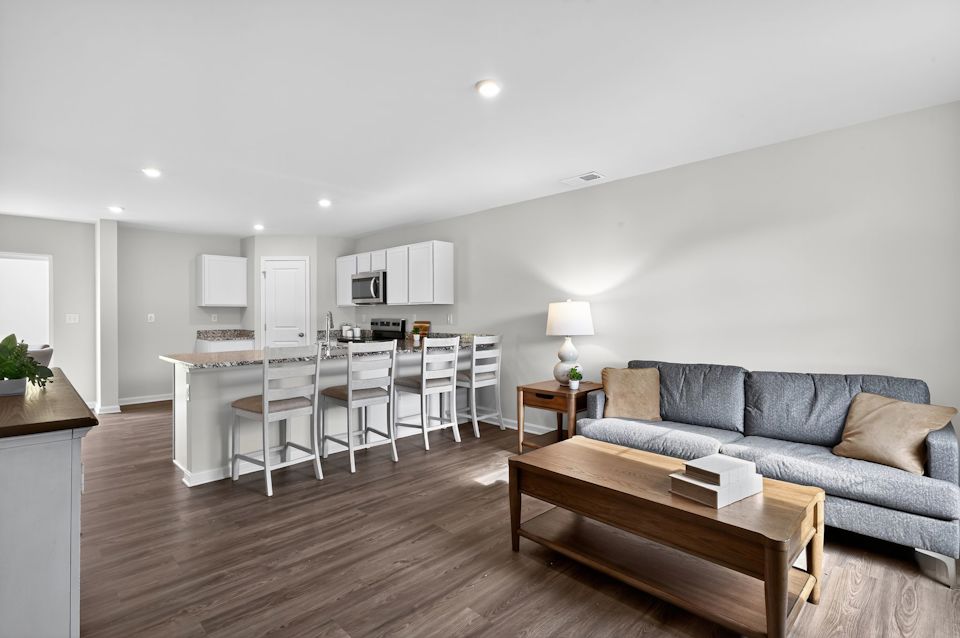 A living room with a couch and a table.