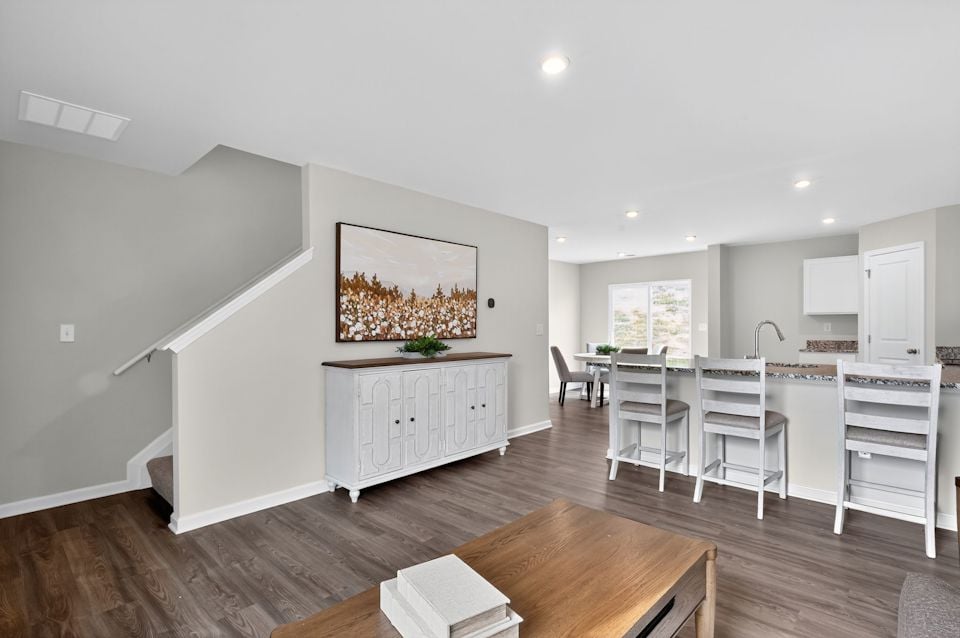 A room with a table and chairs.