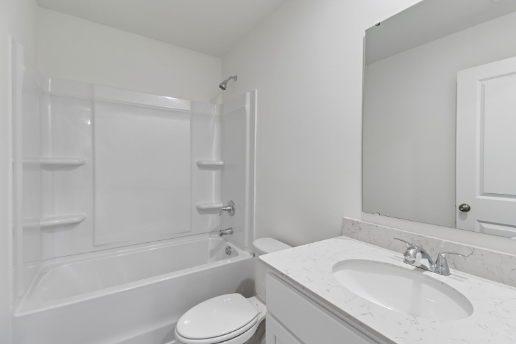 A bathroom with a glass shower.