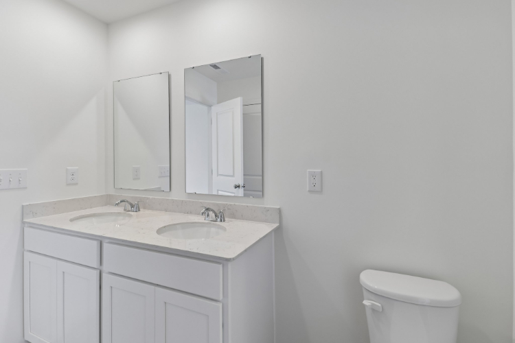 A bathroom with a sink and a toilet.