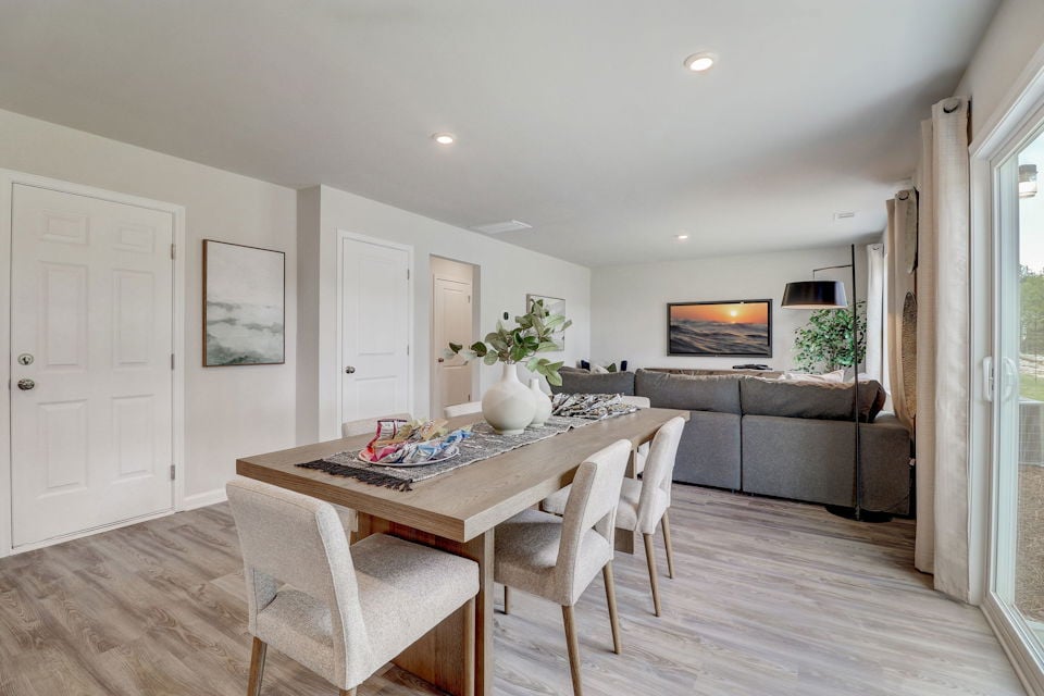 A living room with a couch and a table.