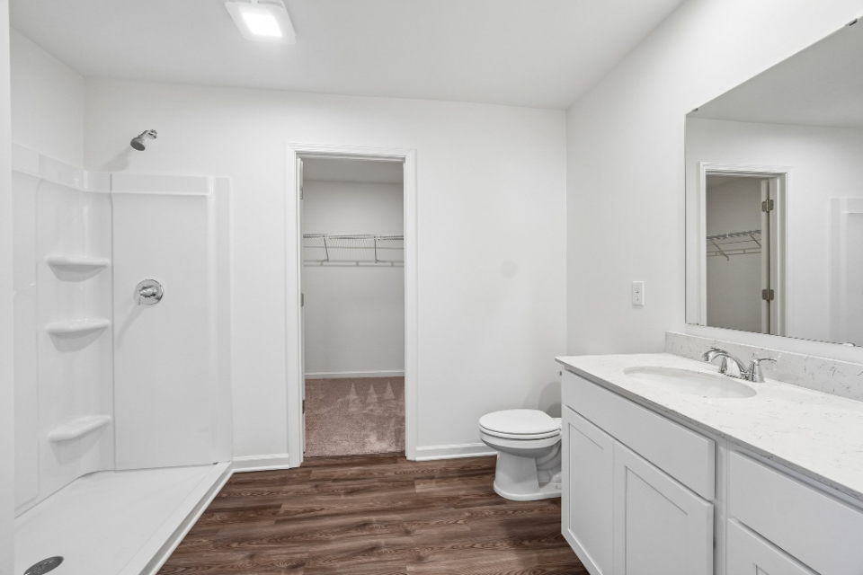 A bathroom with a toilet and sink.