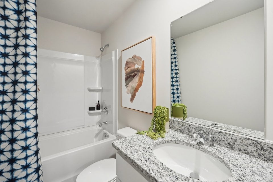 A bathroom with a sink and a bathtub.