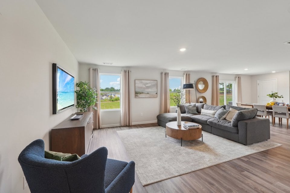 A living room with a large tv.