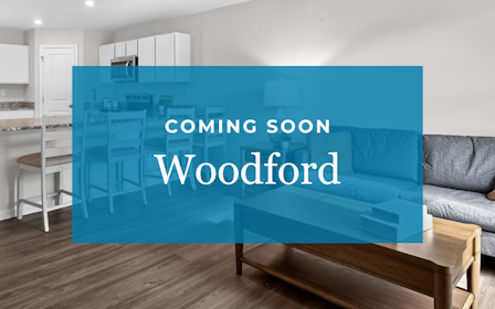 A room with a couch and a table.