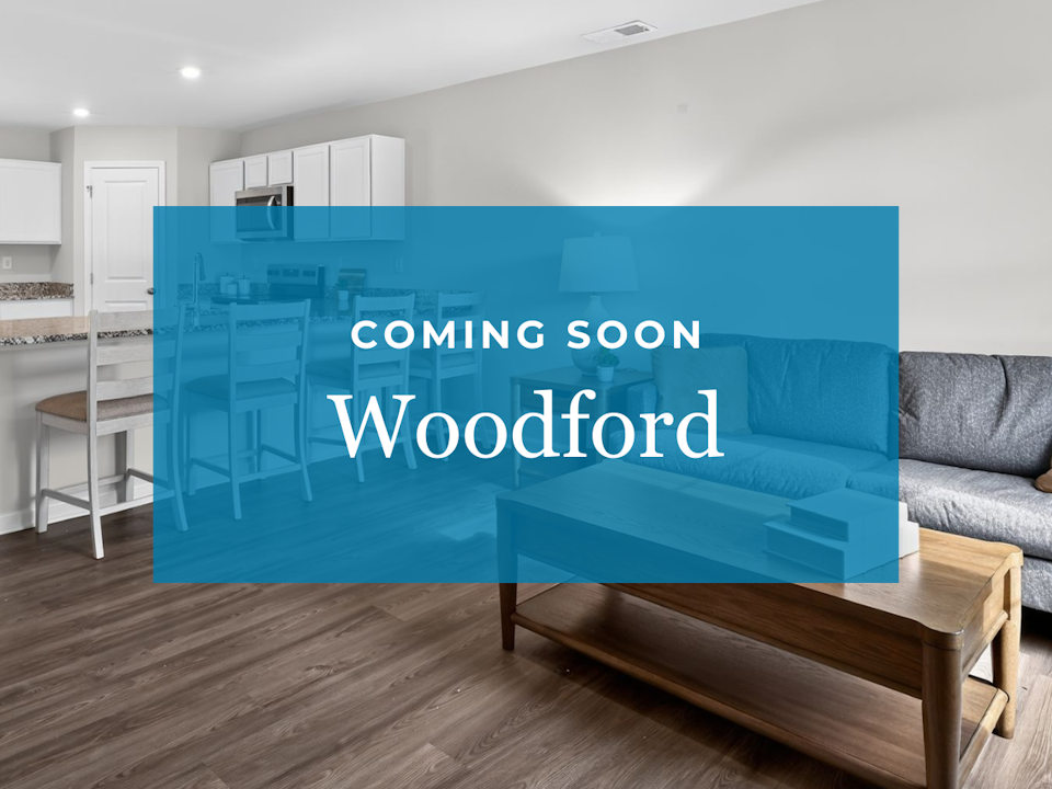 A room with a couch and a table.