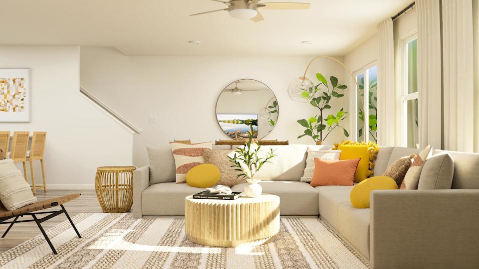 A living room with a large mirror.