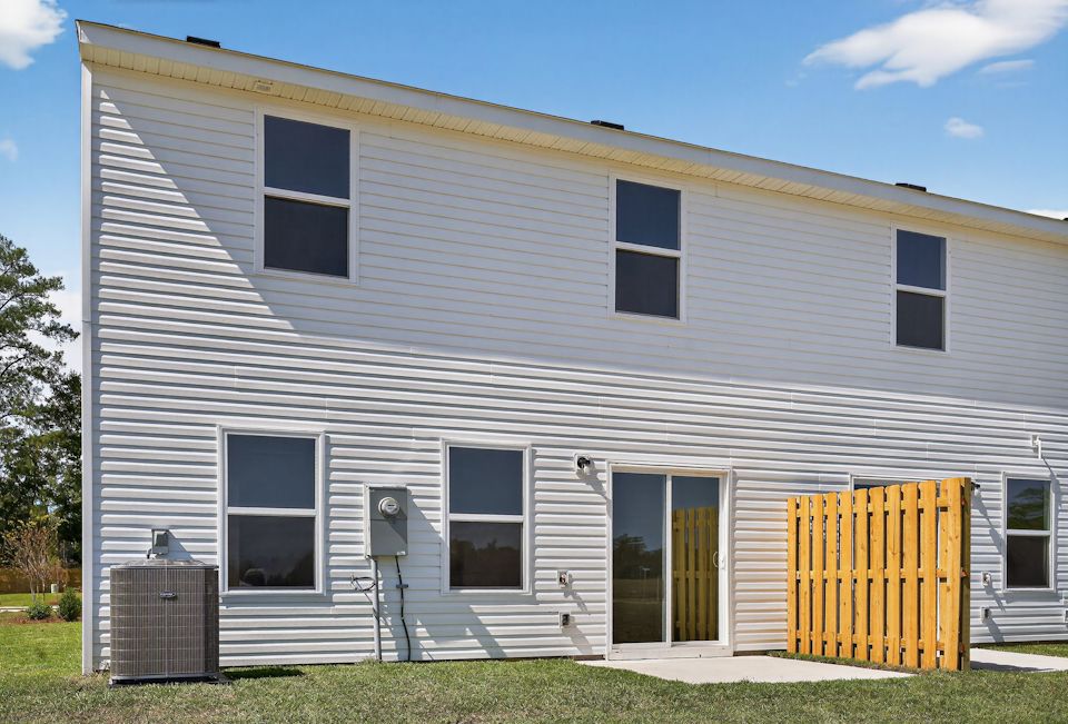 A house with a yellow gate.
