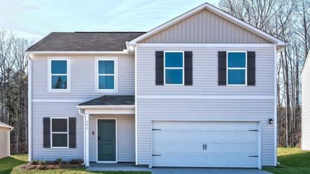 A white house with a garage.