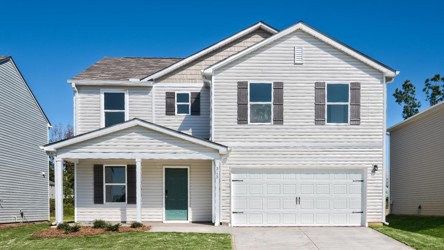 A white house with a garage.
