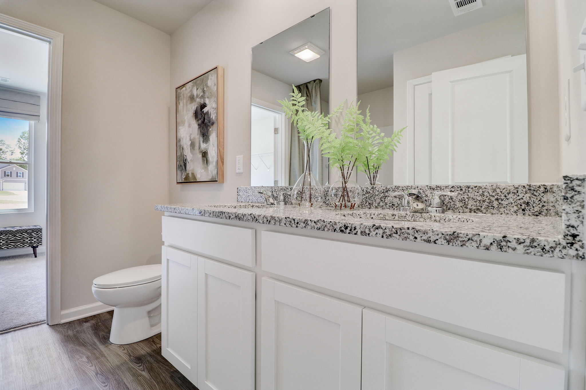 A bathroom with a marble countertop.